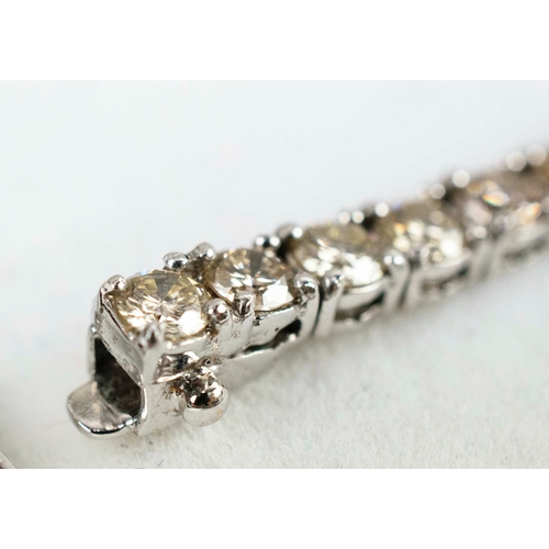 42 - AN 18CT WHITE GOLD DIAMOND SET BRACELET, set with approximately 51 round brilliant cut diamonds, eac... 