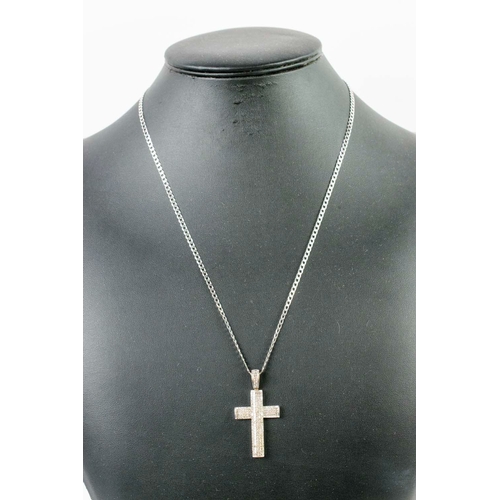 45 - AN 18CT WHITE GOLD DIAMOND SET CROSS PENDANT, the cross and link encrusted with approximately 194 pa... 