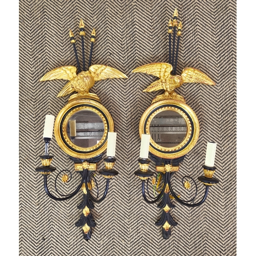 553 - BEAUMONT AND FLETCHER TRAFALGAR WALL LIGHTS, a pair, Regency style each with circular mirror and eag... 