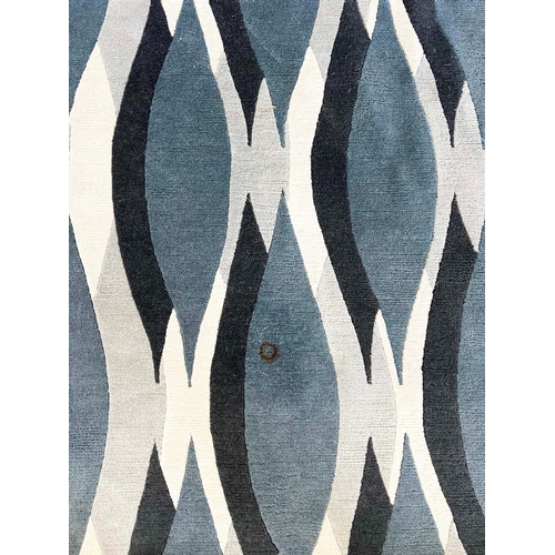 585 - THE RUG COMPANY CARPET, 370cm x 276cm, 'Almond blue' designed by Allegra Hicks.