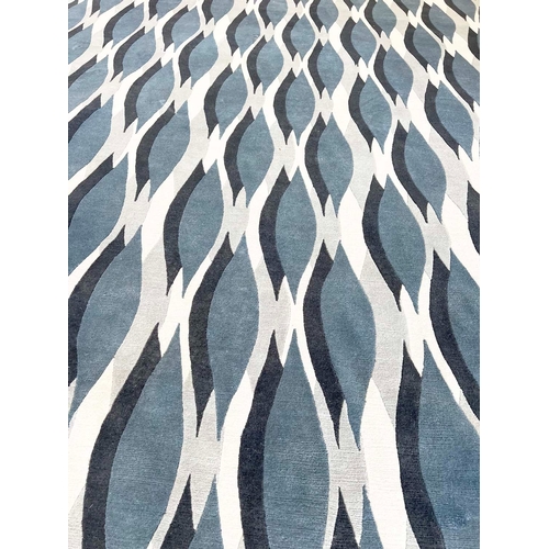 585 - THE RUG COMPANY CARPET, 370cm x 276cm, 'Almond blue' designed by Allegra Hicks.