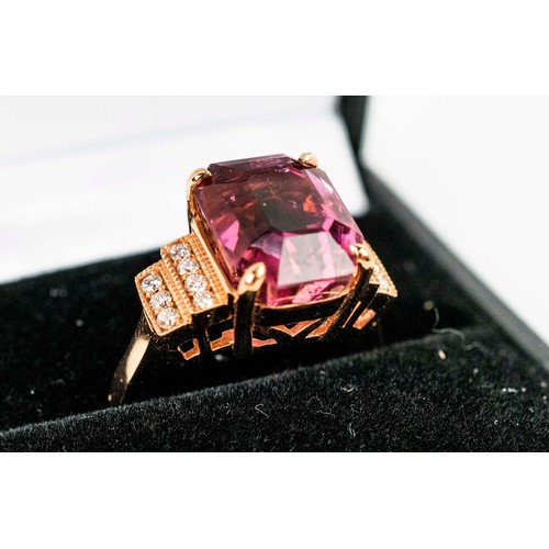 43 - AN 18CT ROSE GOLD PINK TOURMALINE AND DIAMOND DRESS RING, the cushion mixed cut central tourmaline, ... 