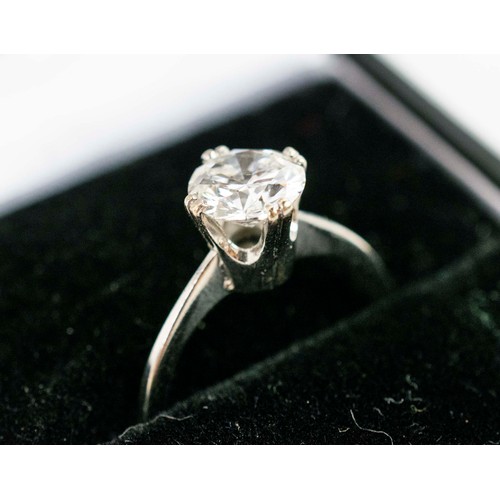 47 - A DIAMOND SOLITAIRE RING, white metal setting, the round brilliant cut stone of approximately 1.25 c... 