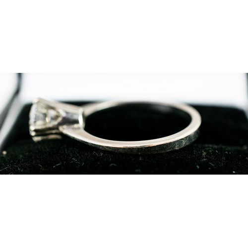 47 - A DIAMOND SOLITAIRE RING, white metal setting, the round brilliant cut stone of approximately 1.25 c... 