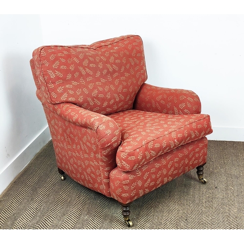 255 - HOWARD STYLE ARMCHAIR AND FOOTSTOOL, in the manner of George Smith, terracotta woven leaf fabric uph... 