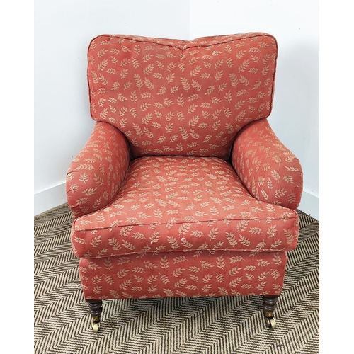 255 - HOWARD STYLE ARMCHAIR AND FOOTSTOOL, in the manner of George Smith, terracotta woven leaf fabric uph... 