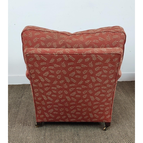 255 - HOWARD STYLE ARMCHAIR AND FOOTSTOOL, in the manner of George Smith, terracotta woven leaf fabric uph... 