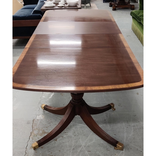 348 - A GEORGE III STYLE MAHOGANY TWIN PEDESTAL DINING TABLE, rosewood crossbanded edge, complete with two... 