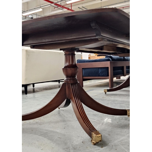 348 - A GEORGE III STYLE MAHOGANY TWIN PEDESTAL DINING TABLE, rosewood crossbanded edge, complete with two... 