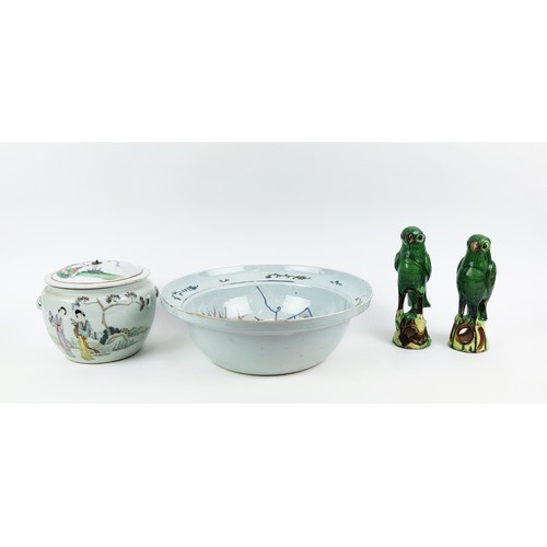 22A - A 20TH CENTURY CHINESE FAMILLE VERTE BASIN, jar with lid and two sancai glazed parrots. (4)