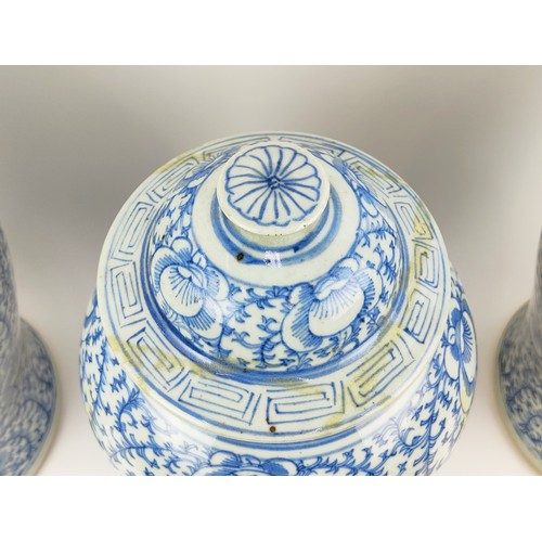 28A - THREE 19TH CENTURY CHINESE BLUE AND WHITE JARS, with lids, largest 45cm H. (3)