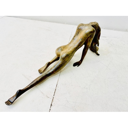 252 - CONTEMPORARY SCHOOL SCULPTURE, of a downward facing female nude, 19cm H x 55cm W x 12cm D.