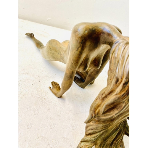 252 - CONTEMPORARY SCHOOL SCULPTURE, of a downward facing female nude, 19cm H x 55cm W x 12cm D.