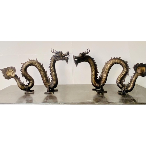 321 - CONTEMPORARY SCHOOL DRAGON SCULPTURES, a pair, Chinese style bronze, each 40cm H x 72cm W x 8cm D. (... 