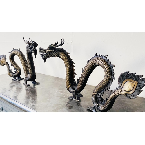 321 - CONTEMPORARY SCHOOL DRAGON SCULPTURES, a pair, Chinese style bronze, each 40cm H x 72cm W x 8cm D. (... 