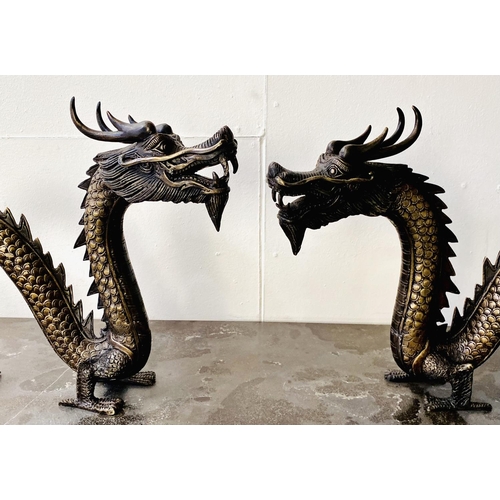 321 - CONTEMPORARY SCHOOL DRAGON SCULPTURES, a pair, Chinese style bronze, each 40cm H x 72cm W x 8cm D. (... 