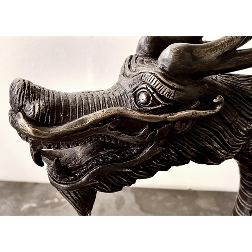 321 - CONTEMPORARY SCHOOL DRAGON SCULPTURES, a pair, Chinese style bronze, each 40cm H x 72cm W x 8cm D. (... 