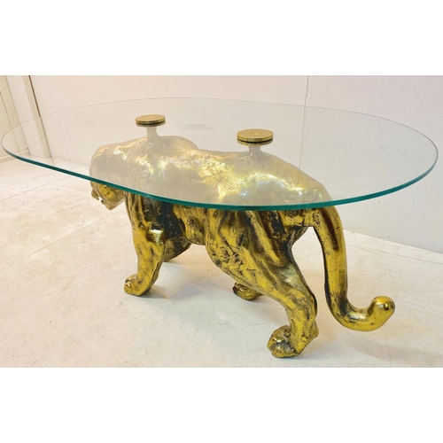 323 - COFFEE TABLE, gilt metal panther base with oval glass top, 45cm D x 96cm W x 66cm D.