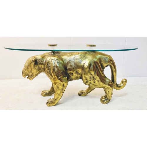 323 - COFFEE TABLE, gilt metal panther base with oval glass top, 45cm D x 96cm W x 66cm D.