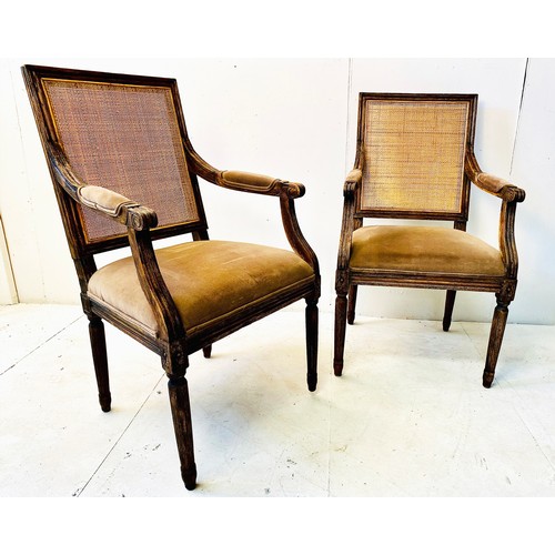 318 - FAUTEUILS, a pair, French oak with rattan backs and brown upholstery, 102cm H x 50cm W x 57cm D. (2)