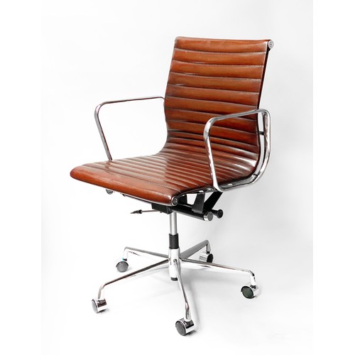 224 - REVOLVING DESK CHAIR, Charles and Ray Eames inspired with ribbed hand finished tan brown leather sea... 