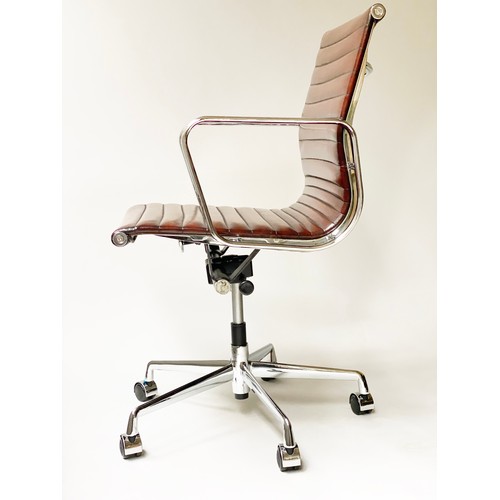 224 - REVOLVING DESK CHAIR, Charles and Ray Eames inspired with ribbed hand finished tan brown leather sea... 