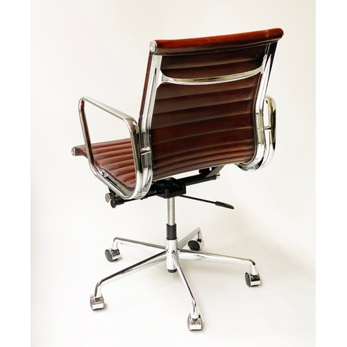 224 - REVOLVING DESK CHAIR, Charles and Ray Eames inspired with ribbed hand finished tan brown leather sea... 