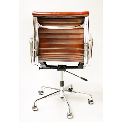 224 - REVOLVING DESK CHAIR, Charles and Ray Eames inspired with ribbed hand finished tan brown leather sea... 