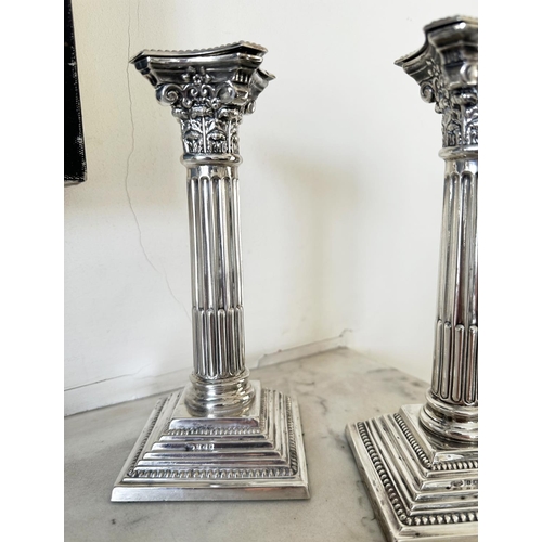 302 - SILVER CANDLESTICKS, a pair, Elizabeth II silver with fluted columns, Corinthian Capitals, detachabl... 