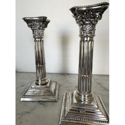 302 - SILVER CANDLESTICKS, a pair, Elizabeth II silver with fluted columns, Corinthian Capitals, detachabl... 