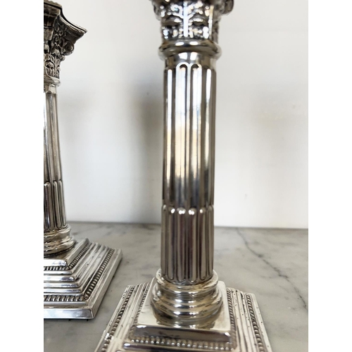 302 - SILVER CANDLESTICKS, a pair, Elizabeth II silver with fluted columns, Corinthian Capitals, detachabl... 