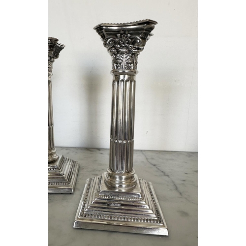 302 - SILVER CANDLESTICKS, a pair, Elizabeth II silver with fluted columns, Corinthian Capitals, detachabl... 