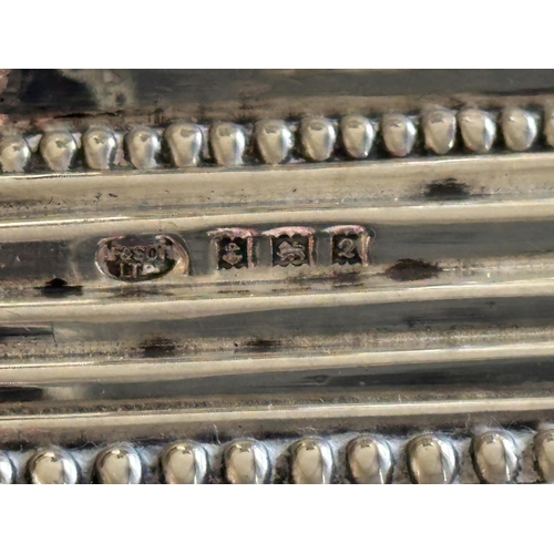 302 - SILVER CANDLESTICKS, a pair, Elizabeth II silver with fluted columns, Corinthian Capitals, detachabl... 