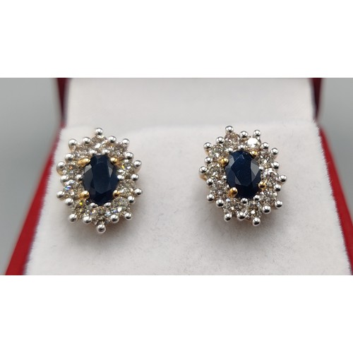 33 - A PAIR OF SAPPHIRE AND DIAMOND STUD EARRINGS, 9ct yellow gold backs, each with a single mixed cut sa... 