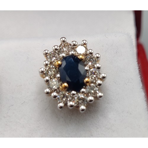 33 - A PAIR OF SAPPHIRE AND DIAMOND STUD EARRINGS, 9ct yellow gold backs, each with a single mixed cut sa... 