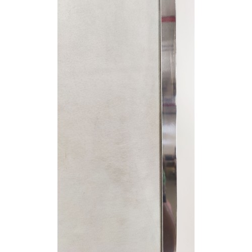 533 - WALL MIRROR, Alcantara upholstered frame, polished metal trim, bevelled plate, 227cm x 100cm.