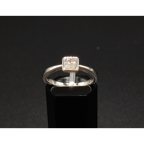 41 - A DIAMOND SET DRESS RING, 9ct white gold shank, set with four princess cut diamonds of approximately... 