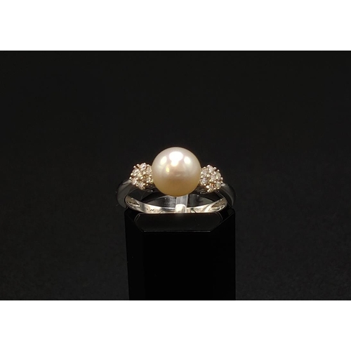 42 - A PEARL AND DIAMOND SET DRESS RING, 9ct white gold shank, the single cultured pearl of 7mm diameter,... 