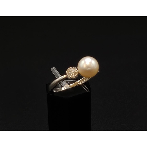 42 - A PEARL AND DIAMOND SET DRESS RING, 9ct white gold shank, the single cultured pearl of 7mm diameter,... 