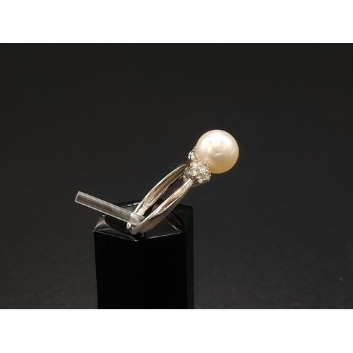 42 - A PEARL AND DIAMOND SET DRESS RING, 9ct white gold shank, the single cultured pearl of 7mm diameter,... 