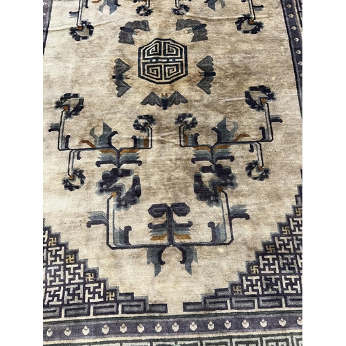 128 - CHINESE RUG, 248cm x 153cm, bat design.