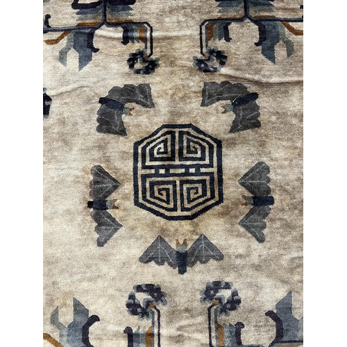 128 - CHINESE RUG, 248cm x 153cm, bat design.