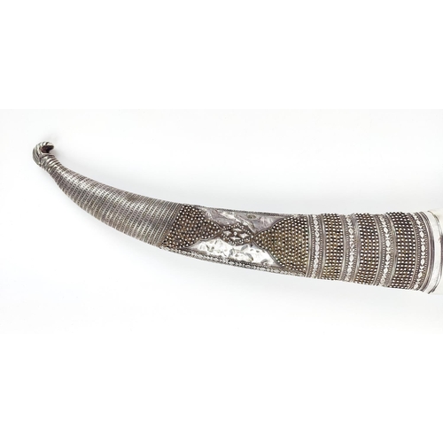 2 - A JAMBIYA DAGGER AND SCABBARD WHITE METAL CASING, steel blade, horn structure to scabbard, 52cm L