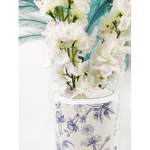 25 - A PAIR OF BLUE AND WHITE PORCELAIN VASES, with faux flowers, each vase 36cm H and 86cm H. (2)