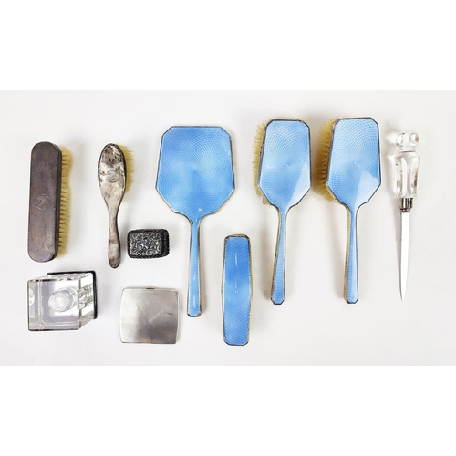 34 - AN ART DECO SILVER AND BLUE ENAMELLED DRESSING TABLE BRUSH SET, plus an ink well, cigarette case, pa... 