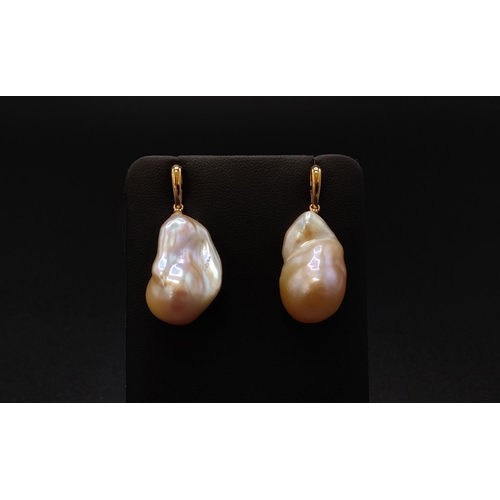 36 - A PAIR OF BAROQUE PEARL PENDANT EARRINGS, with 18ct yellow gold butterfly clips, complete with box