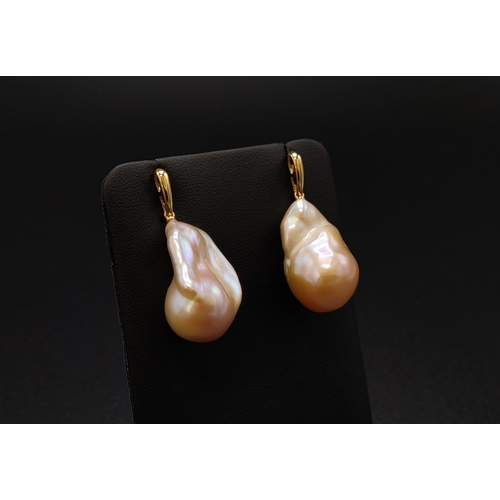 36 - A PAIR OF BAROQUE PEARL PENDANT EARRINGS, with 18ct yellow gold butterfly clips, complete with box