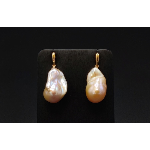 36 - A PAIR OF BAROQUE PEARL PENDANT EARRINGS, with 18ct yellow gold butterfly clips, complete with box