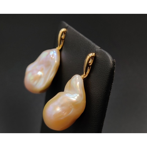 36 - A PAIR OF BAROQUE PEARL PENDANT EARRINGS, with 18ct yellow gold butterfly clips, complete with box