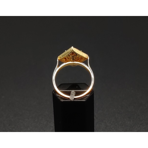 44 - A SILVER GILT KITE SHAPED DRESS RING set with a single tourmaline surrounded by a border of rose cut... 